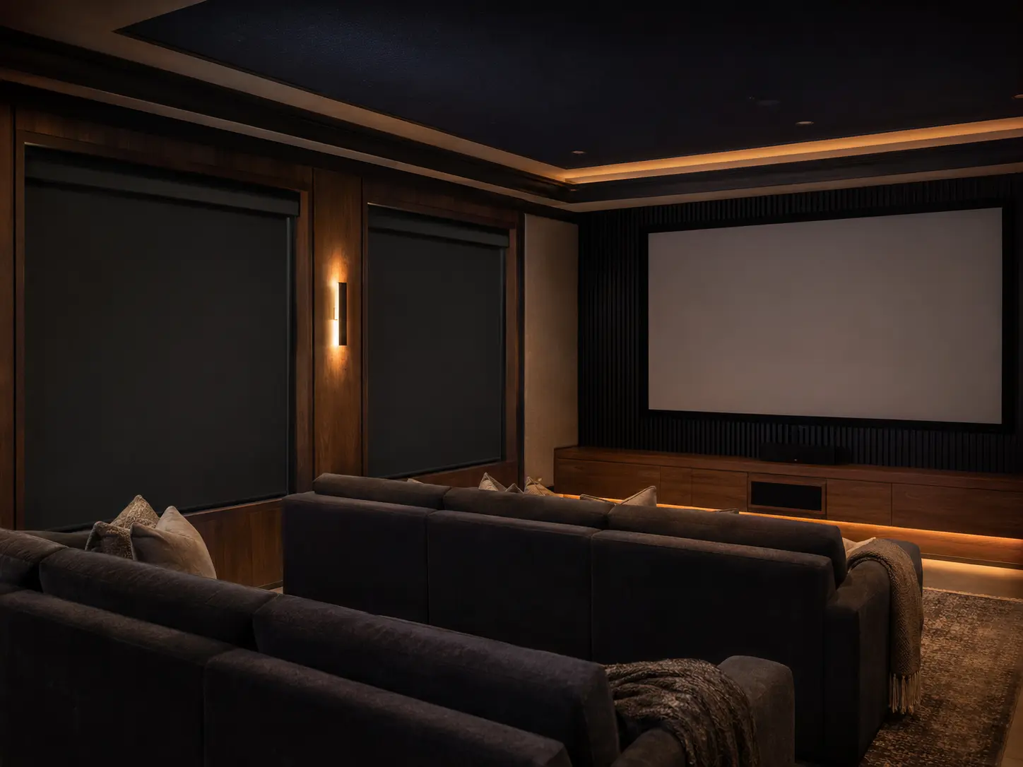 Refined home theater with fitted blackout shades controlling window light