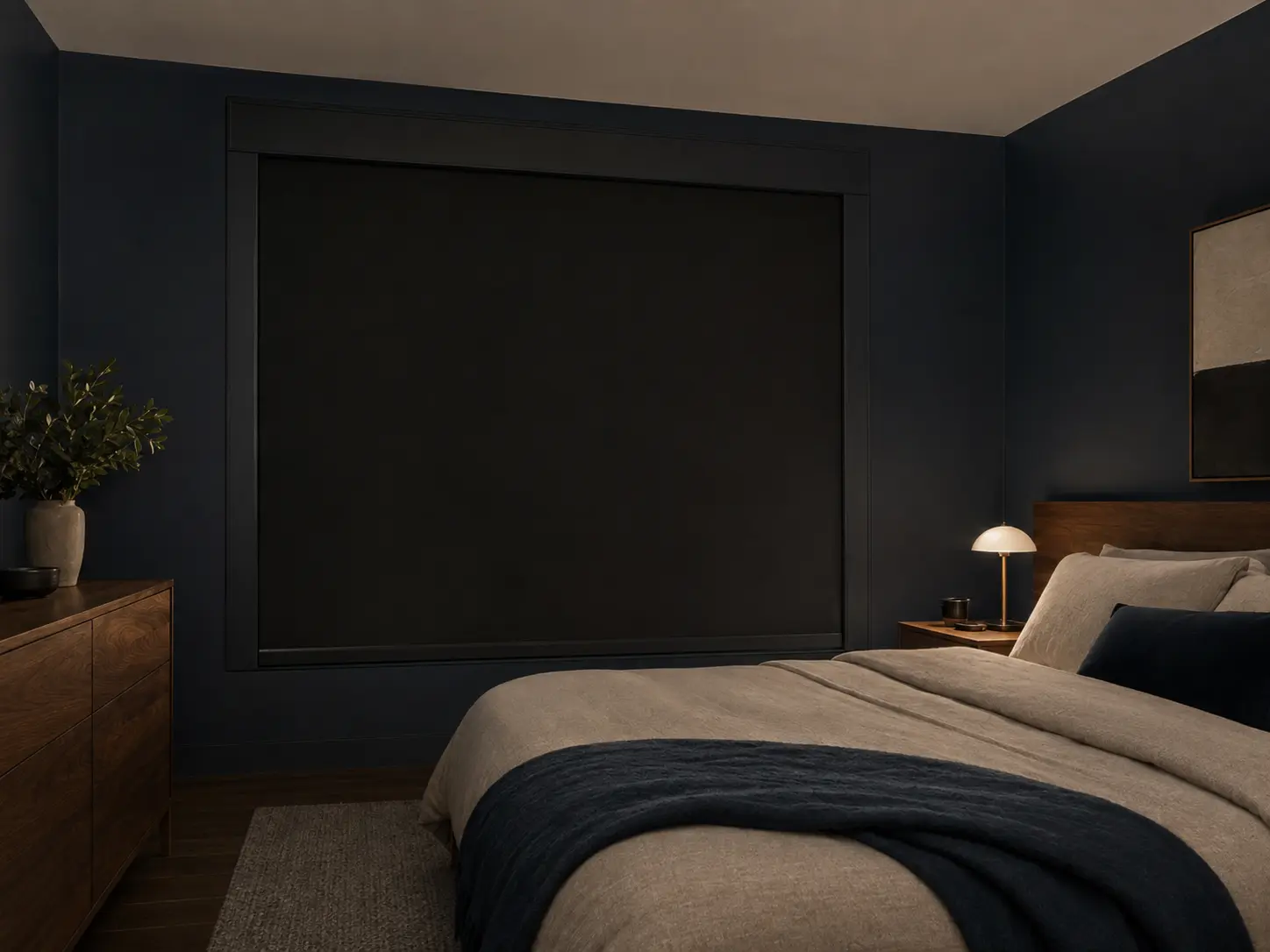 Calm dark bedroom with a professionally fitted blackout shade for daytime sleep